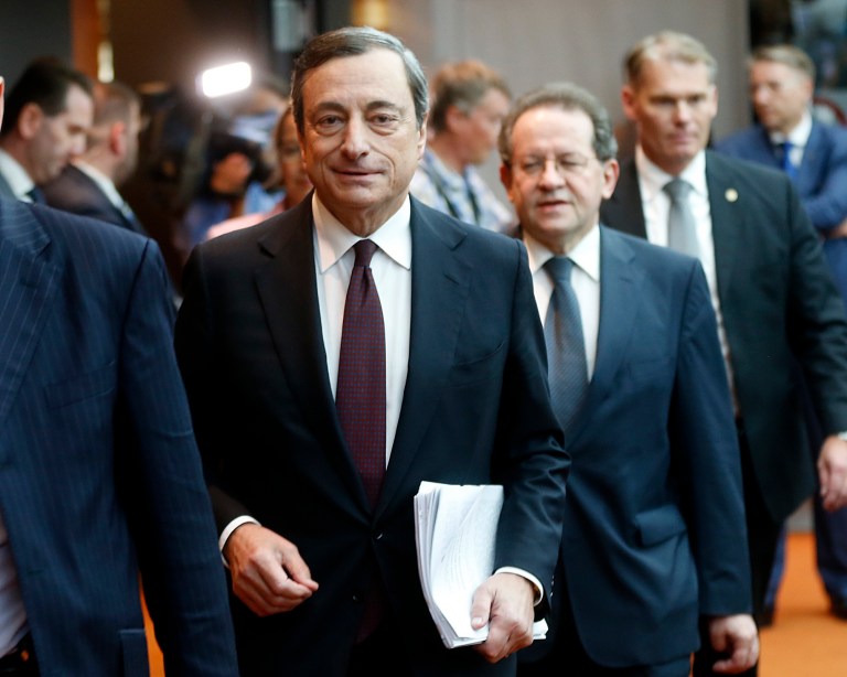 President of European Central Bank  Mario Draghi is on his way to a news conference in Frankfurt, Germany, Thursday,  July 3, 2014, following a meeting of the ECB governing council. The ECB decided to leave its main interest rate unchanged. (AP Photo/Michael Probst)