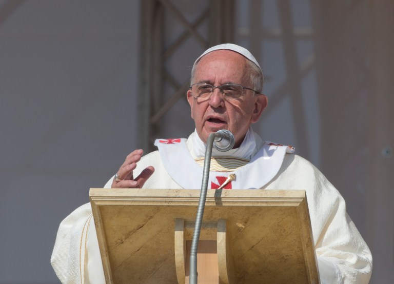 Pope Francis celebrates a Mass in Sibari, southern Italy, Saturday, June 21, 2014. Pope Francis paid a one day visit to Castrovillari, Sibari, and Cassano allo Jonio, in the Calabria region of Italy. Pope Francis comforted the imprisoned father of a slain toddler during a visit Saturday to a southern Italian region infested by one of the world's most powerful crime syndicates. During his one-day pilgrimage to Calabria, Francis met separately with the father and two grandmothers of Coco' Campolongo in the courtyard of a prison in the town of Castrovillari. (AP Photo/Alessandra Tarantino)