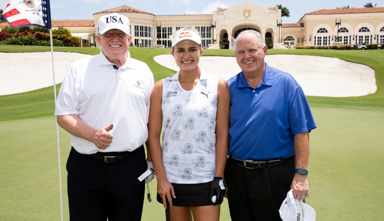 President Trump, professional golfer Lexi Thompson, and radio commentator Rush Limbaugh pose for a photo Friday, April 19, 2019, at the Trump International Golf Club in West Palm Beach, Fla.