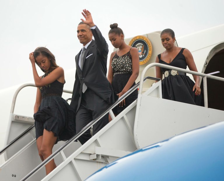President Barack Obama, center, first lady Michelle Obama, left, and daughters Malia, left, and Sasha arrive at the Westchester County Airport, Saturday, Aug. 30, 2014. (AP Photo/Pablo Martinez Monsivais)