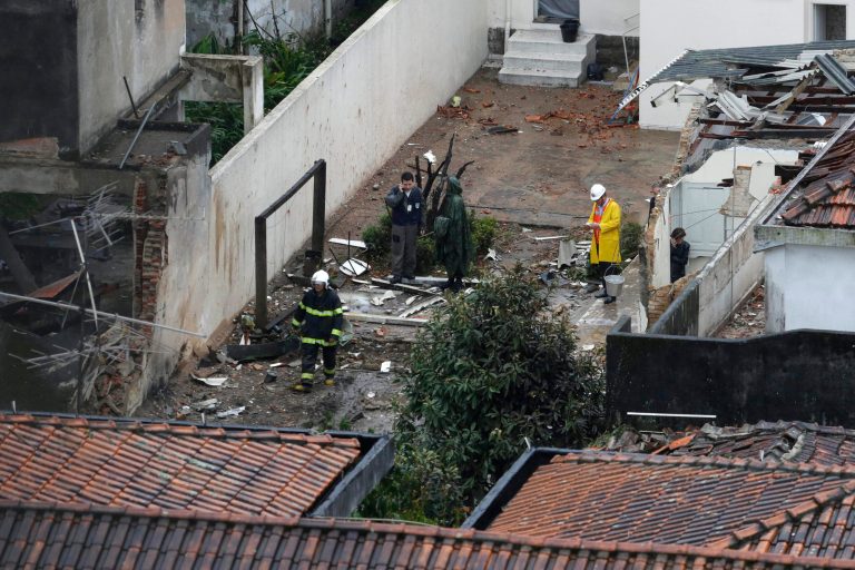 Officials work at the crash site of a small plane that was carrying Brazilian presidential candidate Eduardo Campos and several campaign officials, in the port city of Santos, Brazil, Wednesday, Aug. 13, 2014. All seven people aboard the plane, including a campaign photographer and press advisor, as well as two pilots, died in the crash, City Hall press officer Patricia Fagueiro confirmed. (AP Photo/Nelson Antoine)