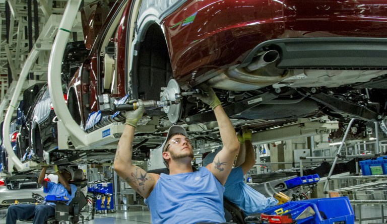 In this June 12, 2013, file photo, workers assemble Volkswagen Passat sedans at the German automaker's plant in Chattanooga, Tenn. (AP Photo/Erik Schelzig, file)