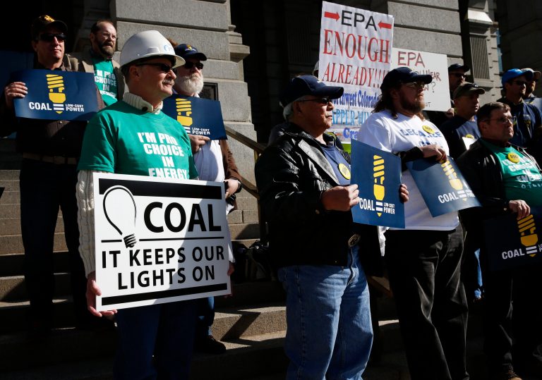 Moffat County Commissioner John Kinkaid, left, and others attend a pro-coal rally in front of the state Capitol, in Denver, Wednesday Oct. 30, 2013. Various industry groups came together for the protest Wednesday, while nearby the Environmental Protection Agency held hearings on future rules to stem emissions from existing power plants, in one of 11 meetings being held across the country. (AP Photo/Brennan Linsley)