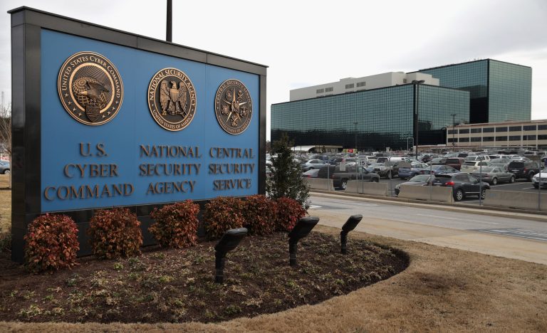 The seals of the U.S. Cyber Command, the National Secrity Agency and the Central Security Service greet employees and visitors at the campus the three organizations share March 13, 2015 in Fort Meade, Maryland. (Photo by Chip Somodevilla/Getty Images)