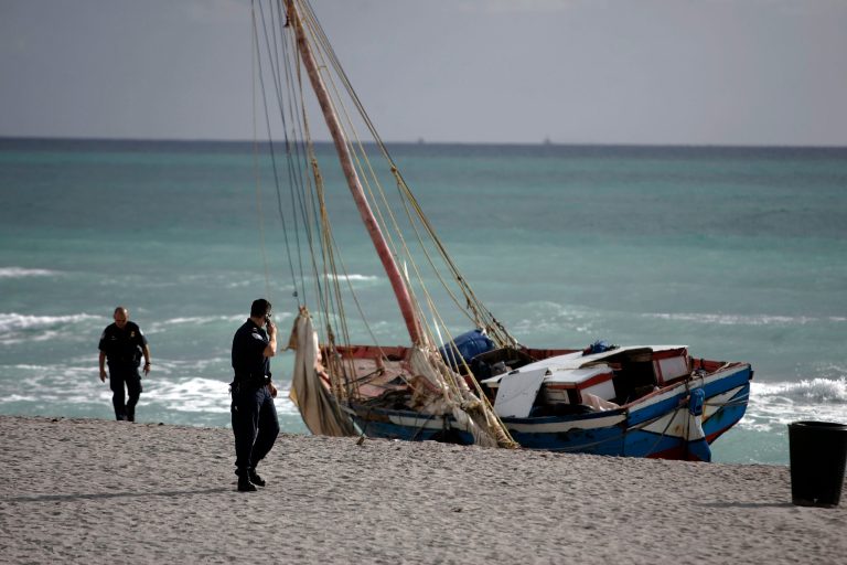 The 30- to 35-foot sailboat that carried more than 100 Haitian migrants to this beach north of Miami sits aground March 28, 2007 at Hallandale Beach, Florida. (Photo by Joe Raedle/Getty images)