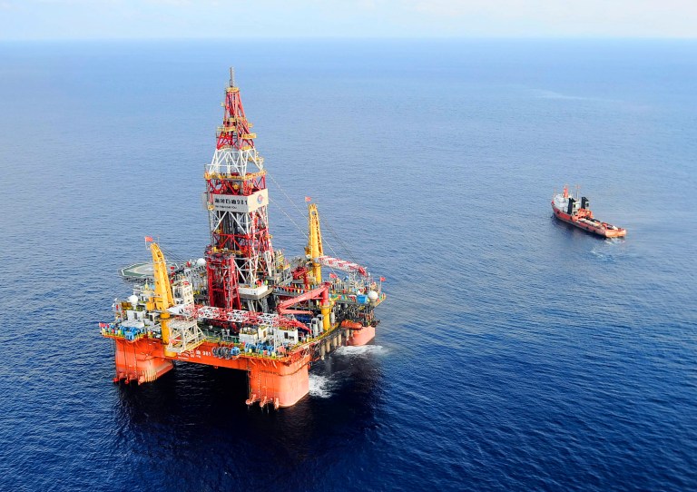 FILE - In this May 7, 2012 file photo released by China's Xinhua News Agency, Haiyang Shiyou oil rig 981, the first deep-water drilling rig developed in China, is pictured at 320 kilometers (200 miles) southeast of Hong Kong in the South China Sea. China on Wednesday, July 16, 2014 moved an oil rig that it had deployed in a section of the South China Sea, triggering a dispute with Vietnam. Beijing deployed the massive rig in early May close to the Paracel Islands, triggering a furious reaction in Hanoi and the most serious uptick in tensions in the waters in years. (AP Photo/Xinhua, Jin Liangkuai, File) NO SALES