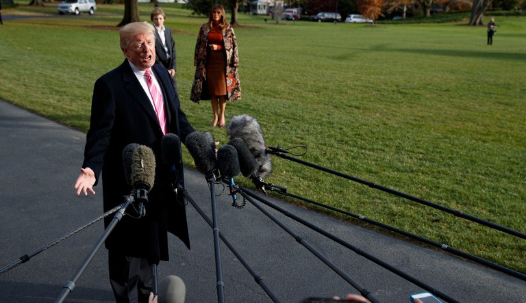 Trump told reporters before leaving for Mar-a-Lago on Tuesday that he would announce next week whether he will appear on the campaign trail. (AP Photo/Evan Vucci)