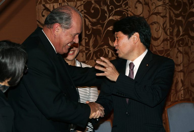 Australia's Defense Minister David Johnston, left,  and his Japanese counterpart Itsunori Onodera, right,  shake hands during a meeting in Tokyo, Wednesday, June 11, 2014. Japan and Australia plan to move ahead with plans to develop a stealth submarine technology this week, as Japanese Prime Minister Shinzo Abe pushes to give his country a more assertive global military role.  (AP Photo/Eugene Hoshiko)