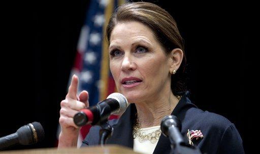 Bachmann and Gingrich praise Cain as he exits race
