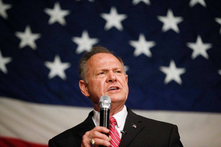 FILE- In this Dec. 5, 2017, file photo, former Alabama Chief Justice and U.S. Senate candidate Roy Moore speaks at a campaign rally in Fairhope Ala. As Alabama's high-profile Senate race heads toward a Tuesday vote, supporters and opponents Moore are bending the truth, or shattering it to pieces, in the campaign's final stretch. (AP Photo/Brynn Anderson, File)