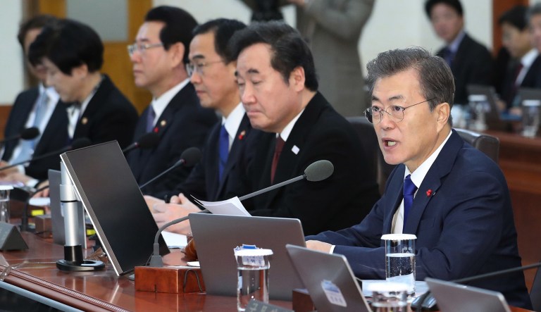 South Korea on Tuesday offered high-level talks with rival North Korea to find ways to cooperate on next month's Winter Olympics in the South. South Korean President Moon Jae-in, right, said a potential dialogue between the two countries would be a 