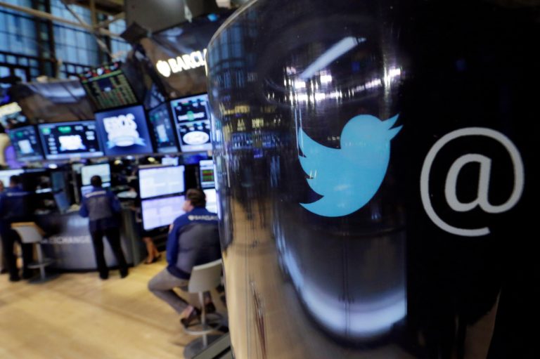 FILE - In this Tuesday, Oct. 13, 2015, file photo, the Twitter logo appears on a phone post on the floor of the New York Stock Exchange. Twitter Inc. reports financial results Wednesday, Feb. 10, 2016. (AP Photo/Richard Drew, File)
