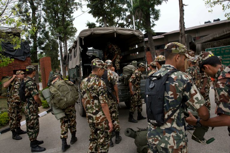Nepalese army soldiers prepare to leave for a rescue mission to the site where the suspected wreckage of a U.S. Marine helicopter, that disappeared earlier this week while on a relief mission in the earthquake-hit Himalayan nation, was spotted, in Kathmandu, Nepal, Friday, May 15, 2015. (AP Photo/Bernat Armangue)