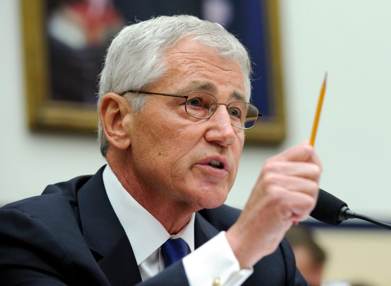Defense Secretary Chuck Hagel testifies on Capitol Hill in Washington, Wednesday, June 11, 2014, before the House Armed Services Committee. Hagel faced angry lawmakers becoming the first Obama administration official to testify publicly about the controversial prisoner swap with the Taliban. (AP Photo/Susan Walsh)