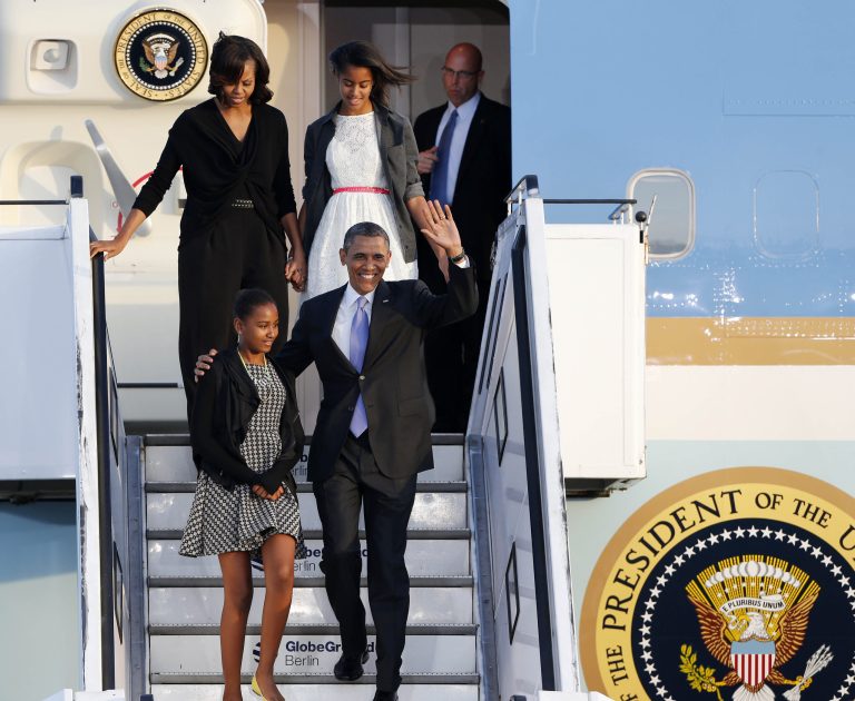 Michael Probst/AP
President  Obama and first lady Michelle Obama and their daughters Sasha, left, and Malia, top right, disembark from Air Force One at the Tegel airport in Berlin on Tuesday.