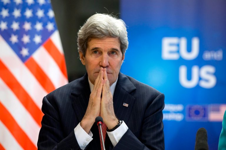 U.S. Secretary of State John Kerry, left, listens as European Union High Representative Catherine Ashton speaks to the media at the start of a U.S.-EU Energy Dialogue meeting at the headquarters of the European Union in Brussels Wednesday April 2, 2014. (AP Photo/Jacquelyn Martin, Pool)