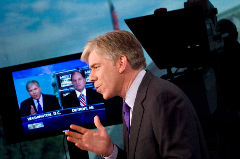 Moderator David Gregory speaks with Fritz Henderson, CEO of General Motors, during a remote interview during a live taping of 'Meet the Press' at NBC studios April 5, 2009 in Washington, DC. (Photo by Brendan Smialowski/Getty Images for Meet the Press)