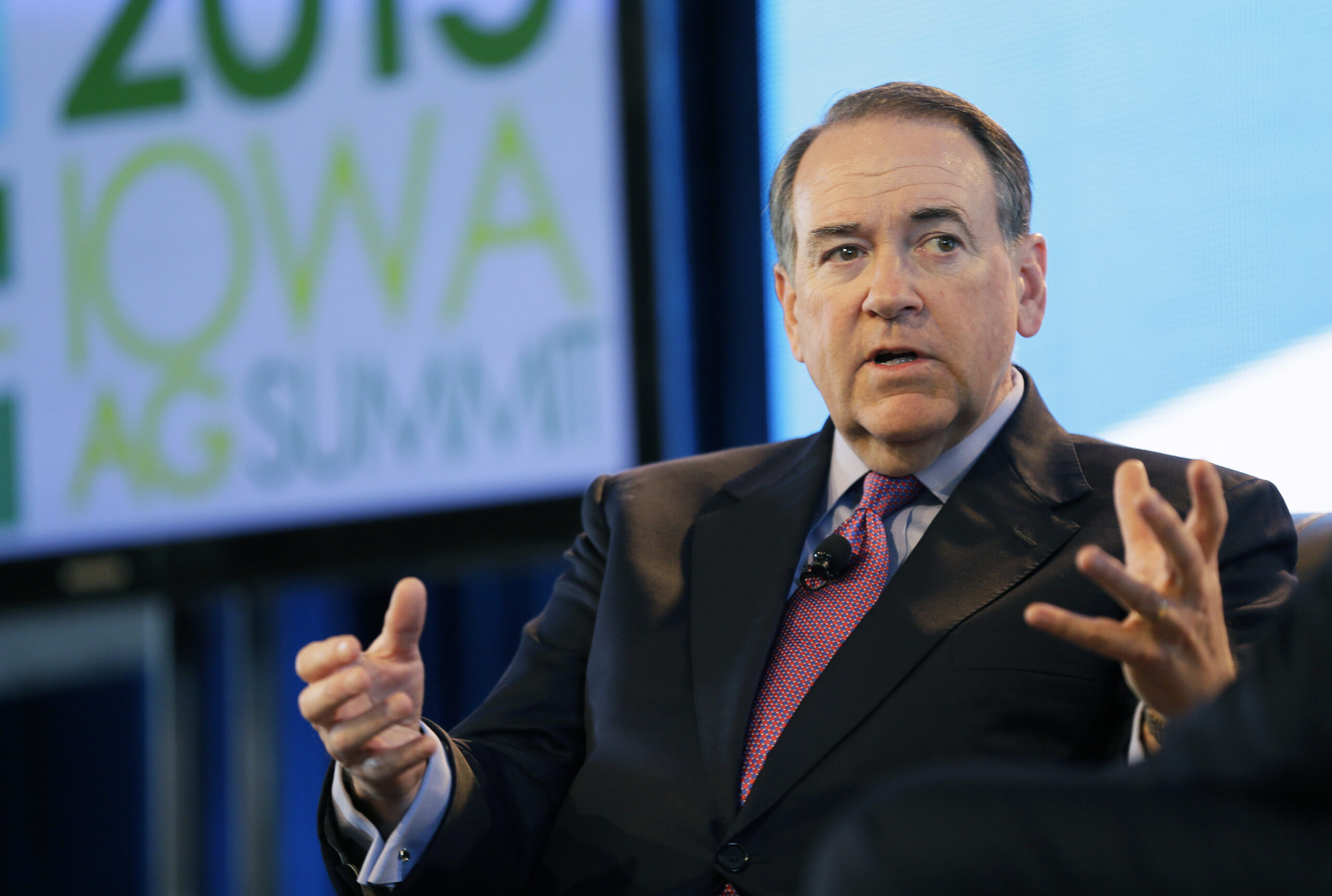 Huckabee touts experience, not faith