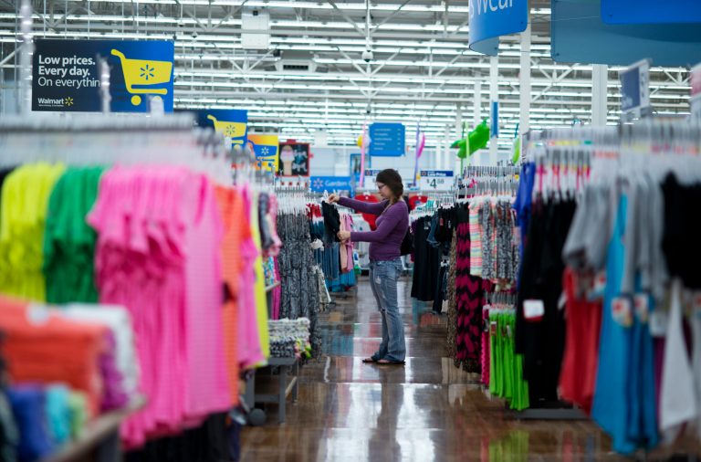 In this June 5, 2014 photo, Chelsea Vick shops for clothes at Wal-Mart Supercenter in Rogers, Ark. The Commerce Department releases retail sales data for May on Thursday, June 12, 2014. (AP Photo/Sarah Bentham)