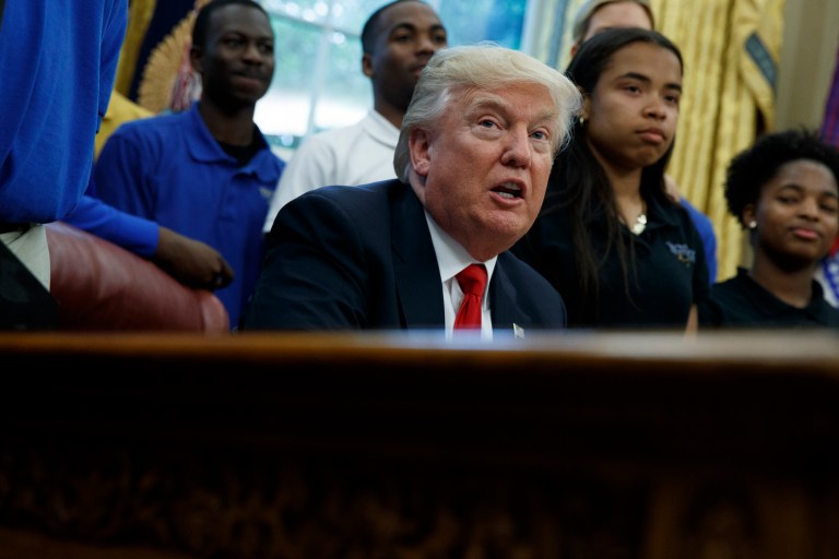 On the campaign trail last year, Donald Trump painted an extremely bleak picture with his pitch to people of color. (AP Photo/Evan Vucci)