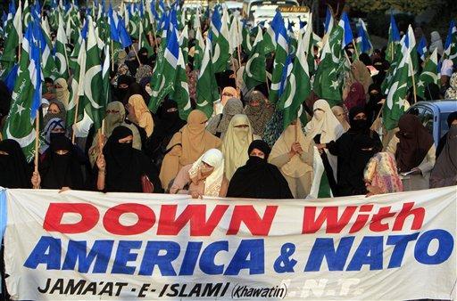 Women supporters of Pakistani religious group Jamaat-e-Islami hold a rally against recent NATO air strikes that killed 24 Pakistani soldiers, Tuesday, Dec. 20, 2011 in Karachi, Pakistan. U.S. military officials took some responsibility for the cross-border friendly fire attack.