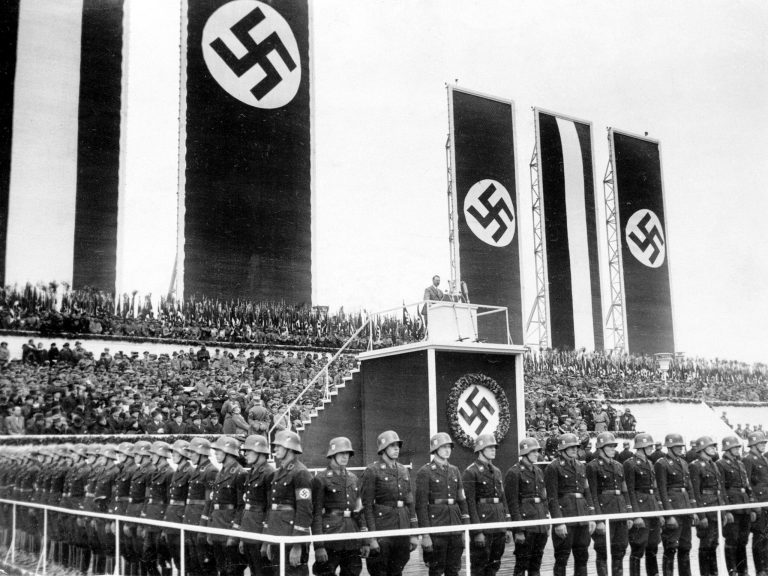 German Chancellor Adolf Hitler delivers his May Day address to an assembly of 1,500,000 Nazi Germans who marched to Tempelhof Airport in Berlin, Germany, to take part in the celebration of Germany's national labor day on May 1, 1935. (AP Photo)