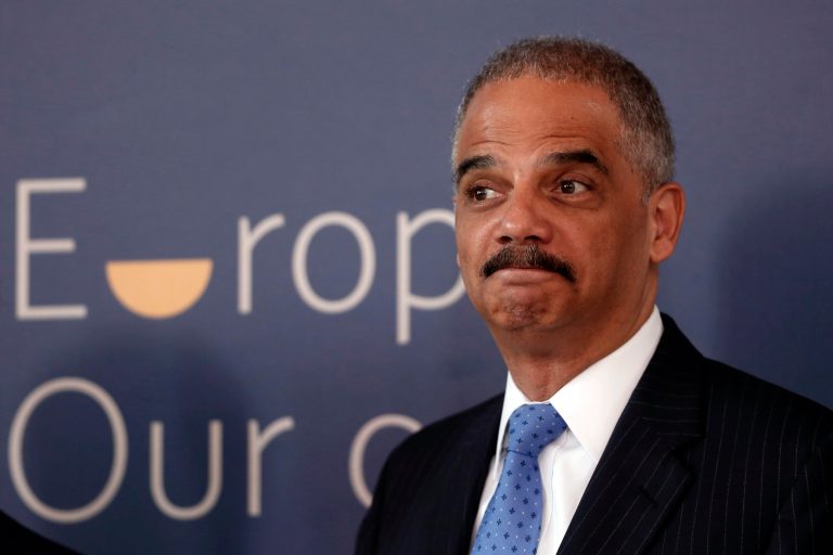 U.S. Attorney General Eric Holder, pose for a photo as he arrives for EU-US Justice and Home Affairs Ministerial Meeting in Athens, on Wednesday, June 25, 2014. (AP Photo/Petros Giannakouris)