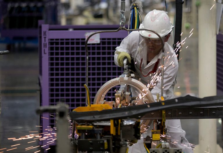 An employee at work in the new multibillion-dollar Honda car plant in Celaya, in the central Mexican state of Guanajuato, Friday, Feb. 21, 2014. Mexico is on track to overtake Japan and Canada and become the United States' No. 1 source of imported cars by the end of next year, part of a national manufacturing boom that has turned the auto industry into a bigger source of dollars than money sent home by migrants. (AP Photo/Eduardo Verdugo)