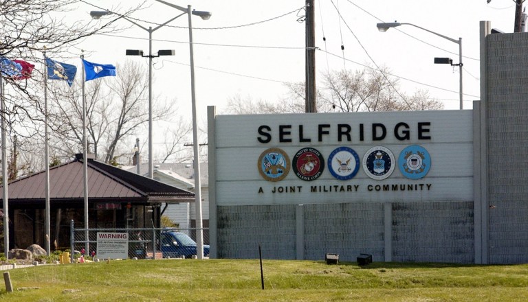 Flags flap in the wind at the gate at Selfridge Air National Guard Base in Harrison Township, Mich., Wednesday, May 4, 2005. In a state where the unemployment rate ranks among the nation's highest and job creation remains at the forefront of government concern, the upcoming round of military base closings could pose another challenge to Michigan's economy. The list from the Base Realignment and Closure commission is expected to be released next week.  (AP Photo/Carlos Osorio)