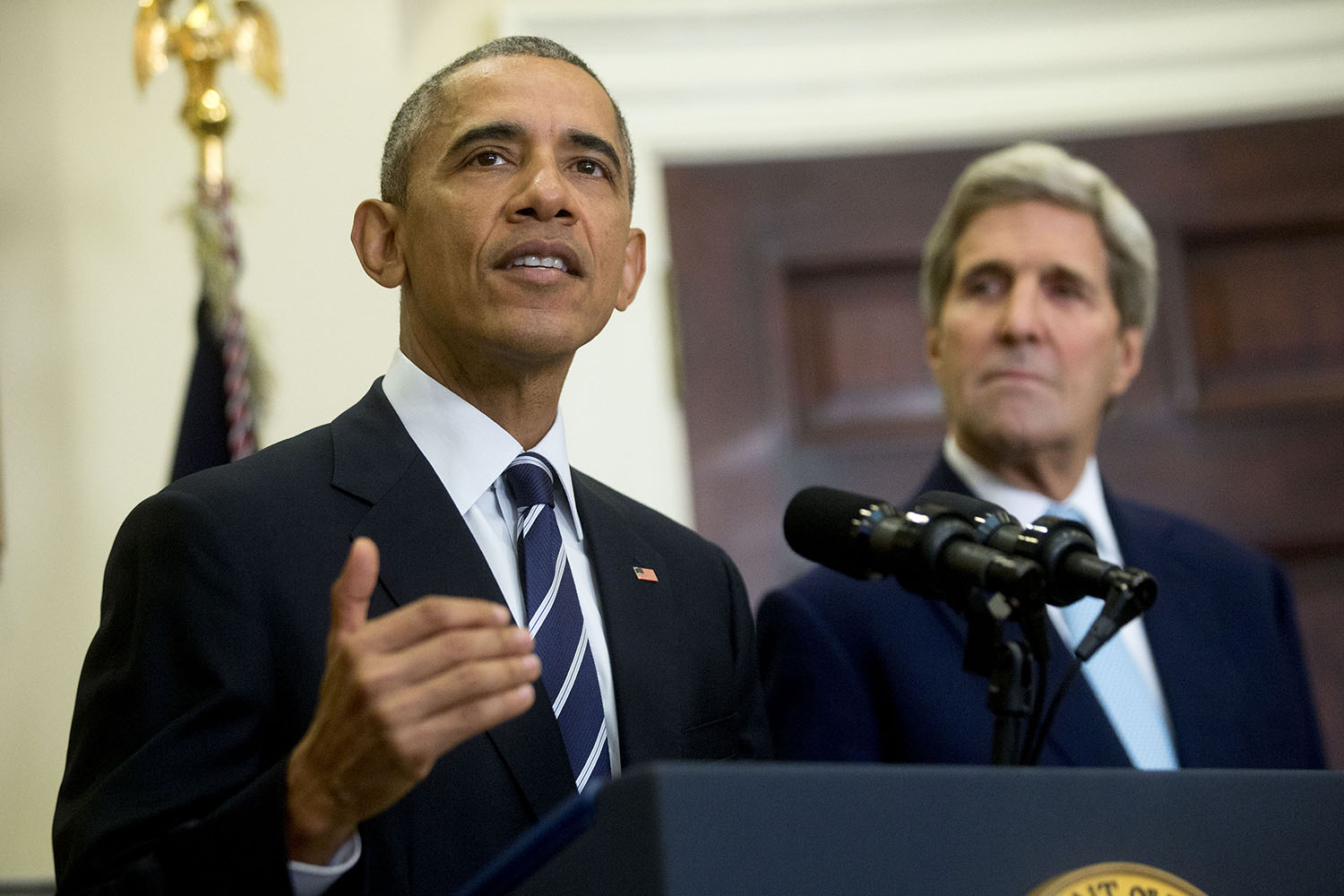 Obama, Kerry praise Iran deal on anniversary