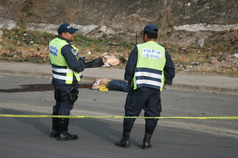 In this March 23, 2013 photo, police stand next to the bodies of Billy 