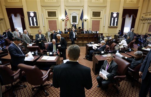 House majority leader, Del. Kirk Cox, R-Colonial Heights, center facing away, delivers the adjournment resolution to the floor of the Senate at the Capitol in Richmond, Va., Saturday, Feb. 23, 2013.  The General Assembly adjourned for the 2013 session.  (AP Photo/Steve Helber)