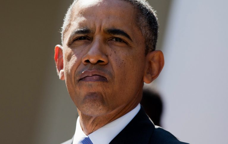 President Barack Obama pauses while speaking in the Rose Garden of the White House in Washington, Tuesday, Oct. 1, 2013, about the government shutdown. Congress plunged the nation into a partial government shutdown Tuesday as a protracted dispute over Obama's signature health care law reached a boiling point, forcing some 800,000 federal workers off the job. (AP Photo/ Evan Vucci)