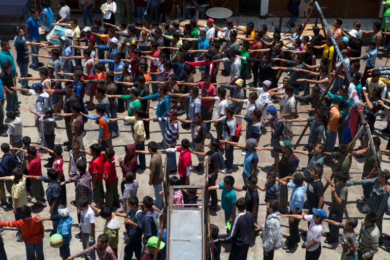 Boys and young men line up to receive a meal provided by the government, at The Great Family group home in Zamora, Michoacan state, Mexico, Thursday, July 17, 2014. After a police raid on the refuse-strewn group home Tuesday, residents of the shelter told authorities that some employees beat and raped residents, fed them rotting food or locked them in a tiny 