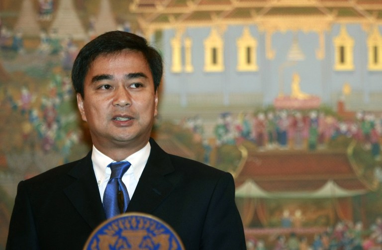   FILE - In this July 19, 2011 file photo, outgoing Thai Prime Minister Abhisit Vejjajiva talks to reporters during a news conference on Thailand's dispute with Cambodia over an ancient temple at Government House in Bangkok. Thai law enforcement authorities announced Thursday, Dec. 6, 2012, that they will file murder charges against Abhisit and his deputy in the first prosecutions of officials for their roles in a deadly 2010 crackdown on anti-government protests. (AP Photo/Apichart Weerawong, File)  