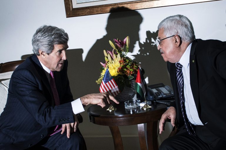 Secretary of State John Kerry, left, talks with Palestinian President Mahmoud Abbas at the presidential compound in the West Bank city of Ramallah on Saturday. (AP Photo/Brendan Smialowski, Pool)
