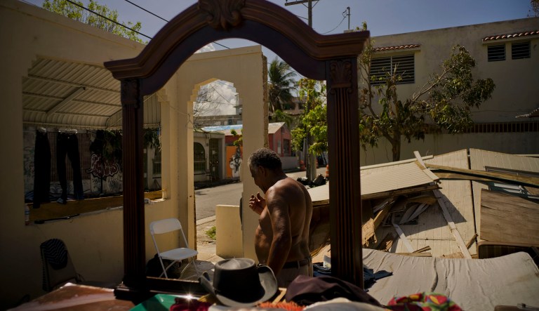 Efrain Diaz Figueroa walks around at the remains of the house of his sister destroyed by Hurricane Maria in San Juan, Puerto Rico, Monday, Oct. 9, 2017. (AP Photo/Ramon Espinosa)