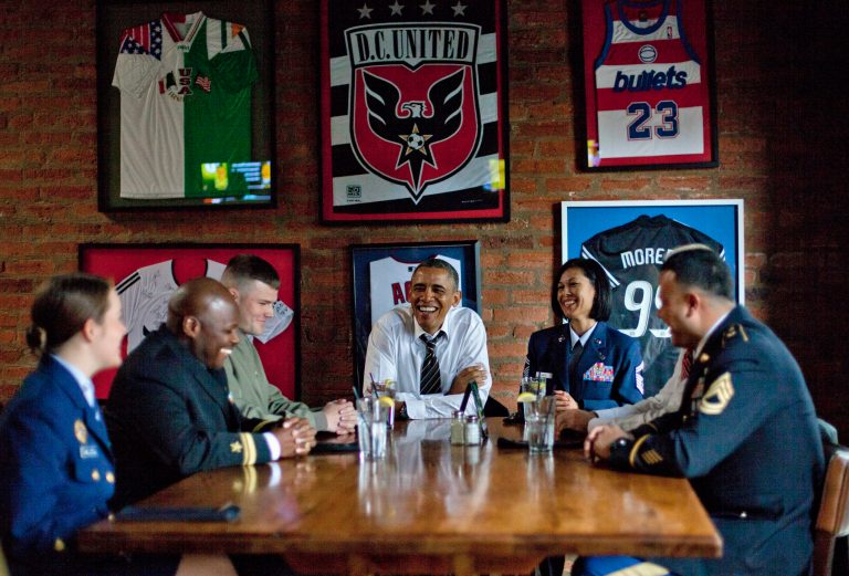 President Obama and Vice President Biden meet with five active duty service members at Molly Malone's restaurant on Barracks Row in Washington on Tuesday. (AP Photo/Pablo Martinez Monsivais)