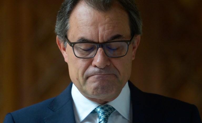 Catalonia's regional president Artur Mas bites his lips during a press conference at the Generalitat Palace in Barcelona, Spain, Tuesday, Oct. 14, 2014. Mas called a press conference amid speculation he will discuss the future of an independence referendum the central government in Madrid says would be illegal. Plans for the Spain's powerful northeastern region of Catalonia to hold a secession referendum Nov. 9 look decidedly uncertain as a pro-vote party says Mas told them the poll cannot go ahead. (AP Photo/Manu Fernandez)