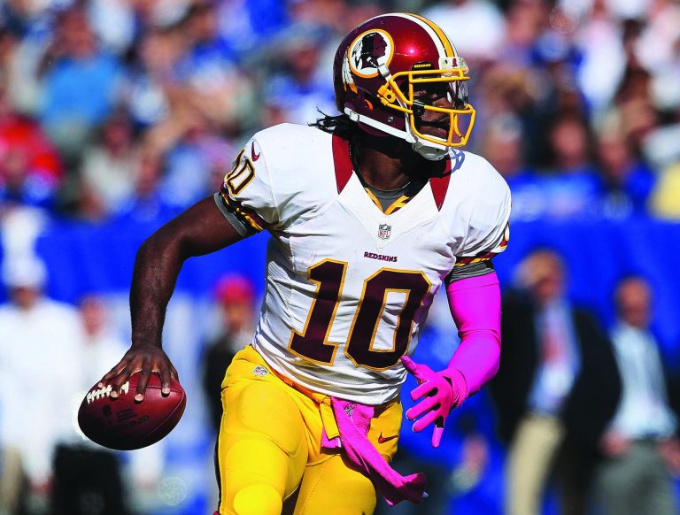 Alex Trautwig/Getty Images 
Redskins quarterback Robert Griffin III leads the league in completion percentage (70.4) and is third in passer rating (101.8).