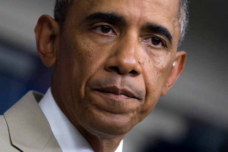 President Barack Obama listens in the James Brady Press Briefing Room of the White House in Washington, Thursday, where he spoke about the economy, Iraq, and Ukraine, before convening a meeting with his national security team on the militant threat in Syria and Iraq. (AP Photo/Evan Vucci)