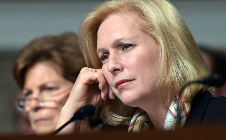 Sen. Jeanne Shaheen, D-N.H., left, and Sen. Kirsten Gillibrand, D-N.Y., right, listen to testimony during the Senate Armed Services Committee hearing on Capitol Hill in Washington, Thursday, Jan. 25, 2018, on global challenges and U.S. national security strategy. The witnesses were former Secretary of State Henry Kissinger, former Secretary of State George Shultz and former Deputy Secretary of State Richard Armitage. (AP Photo/Susan Walsh)