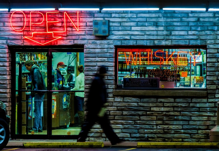 FILE - In this Jan. 26, 2013, file photo, a shopper walks by the Wendell Smith's liquor store in Nashville, Tenn. State lawmakers on Tuesday, Jan, 21, 2014 reconvened the 108th Tennessee General Assembly in a legislative session that is expected to feature debates over creating a school voucher program and whether to allow supermarkets to sell wine. (AP Photo/Erik Schelzig, file)