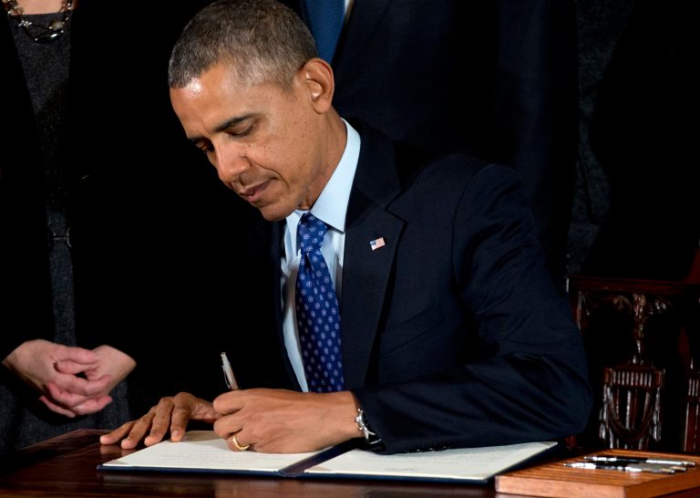 FILE - In this Jan. 22, 2014, file photo, President Barack Obama signs a memorandum creating a task force to respond to campus rapes during an event for the Council on Women and Girls in the East Room of the White House in Washington. The Obama administration is taking steps to help colleges and universities measure the magnitude of sexual assaults on their campuses and provide better protections for victims. A White House task force on sexual assault recommends in a report to be released April 29 that schools identify trained, confidential victim's advocates. It also wants schools to conduct surveys to better gauge the frequency of sexual assaults on their campuses. (AP Photo/Carolyn Kaster, File)