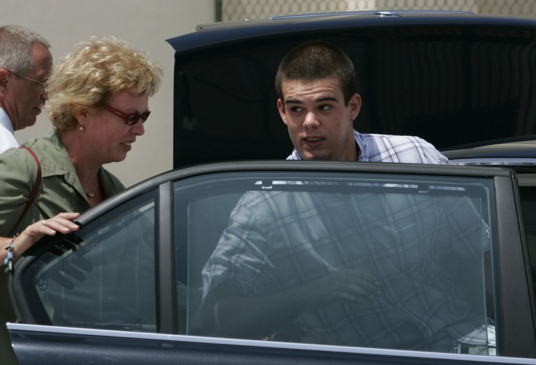 FILE - In this Sept. 3, 2005 file photo, Dutch teen Joran van der Sloot, 18, enters his family's car as his mother Anita closes the door after he was conditionally released from the KAI jail in San Nicolas, Aruba. Van der Sloot, the prime suspect in the 2005 disappearance of U.S. teen Natalee Holloway, married his pregnant Peruvian girlfriend on Friday, July 4, 2014 in a ceremony at the maximum-security prison where he is serving 28 years for murdering a woman he met in a Lima casino. (AP Photo/Leslie Mazoch, File)