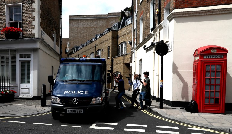 In this photo, a police van leaves the back entrance of Westminster Magistrates Court in London on Friday, June 23, 2017. British authorities charged Darren Osborne with terrorism-inspired murder and attempted murder in connection with a truck attack on a crowd of Muslim worshippers near two north London mosques, and a Crown Court on Thursday, Feb. 1, 2018, later found Osborne guilty of murder and attempted murder. (AP Photo/Kirsty Wigglesworth)