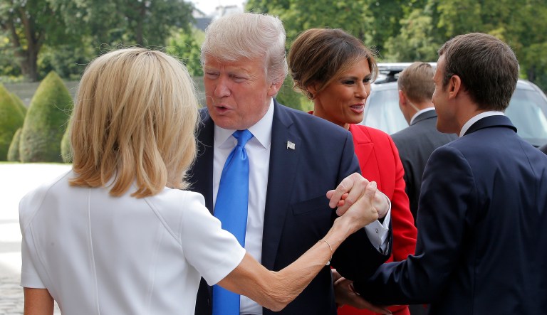 President Trump greeted French President Emmanuel Macron with a nine-second handshake then dropped an awkward handclasp-hug combo on the mature first lady of France. (AP Photo/Michel Euler)