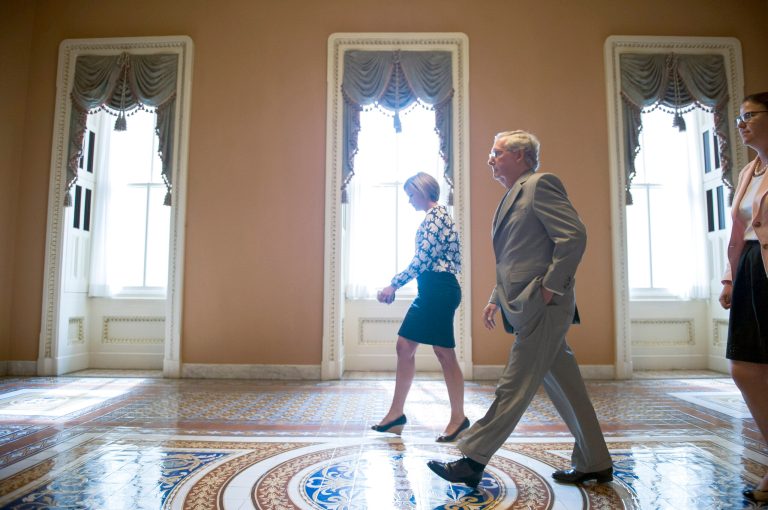 Senate Majority Leader Mitch McConnell, R-Ky., walks from the Senate Chamber after gaveling open a special session to extend surveillance programs, in Washington, Sunday, May 31, 2015. (AP Photo/Cliff Owen)