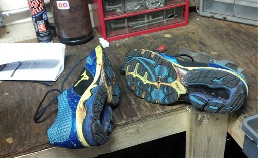 This image taken and provided by Lucas Carr shows the blood-stained shoes he was wearing during the Boston Marathon, on Monday, April 15, 2013. Army Sgt. Lucas Carr arrived at the finish at 2:48 p.m., and was standing with his girlfriend about 50-yards away when the bombs went off about a minute later. 