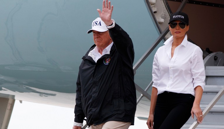 President Trump, accompanied by first lady Melania Trump, waves as they arrive in Corpus Christi, Texas, for briefings on Hurricane Harvey relief efforts. (AP Photo/Evan Vucci)